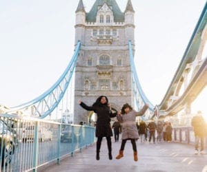 Mom and daughter jumping on London Bridge