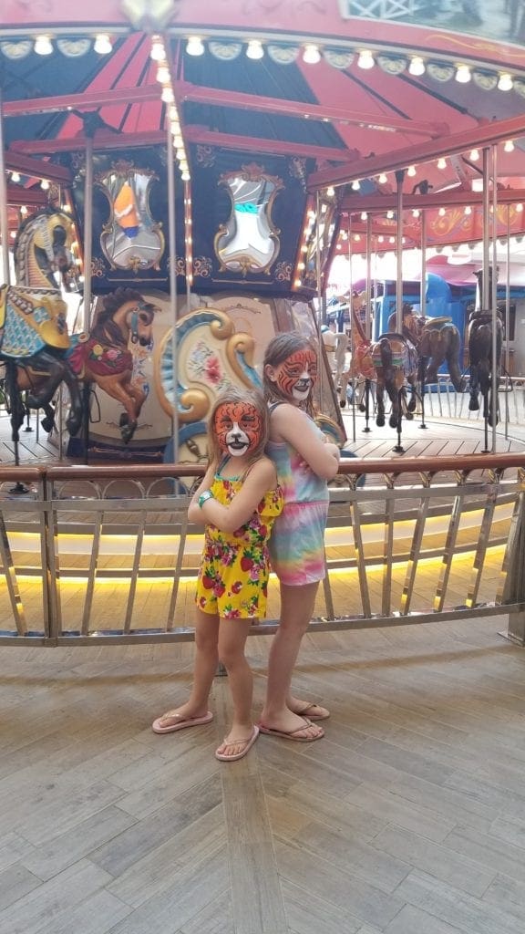 Carousel and face paint on the cruise