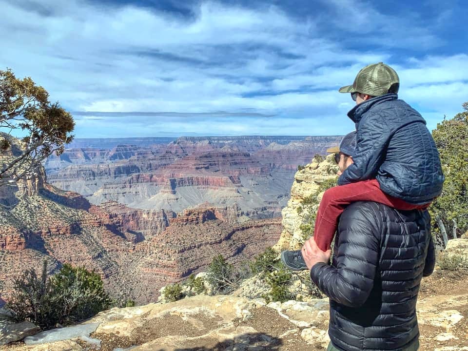 Kid on the dads shoulder in Grand Canyon National Park.