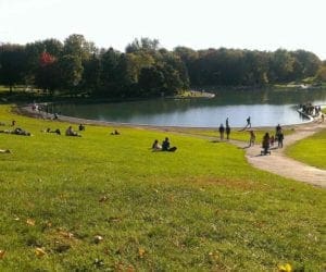 People enjoying a lake and sunny weather in Montreal
