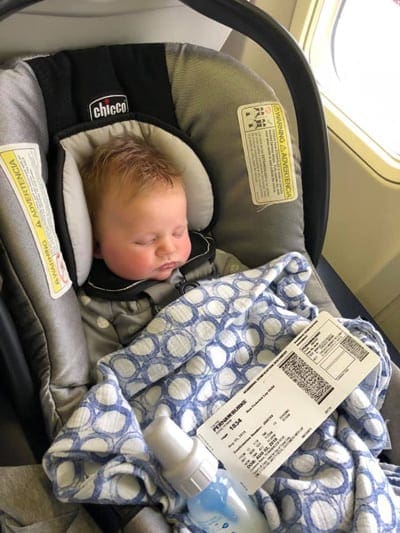 Baby sleeping in carseat on U.S. airline