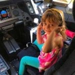 Hawaiin Airlines girl acting like pilot. best U.S airlines children.