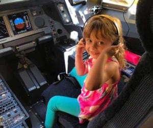 Hawaiin Airlines girl acting like pilot. best U.S airlines children.