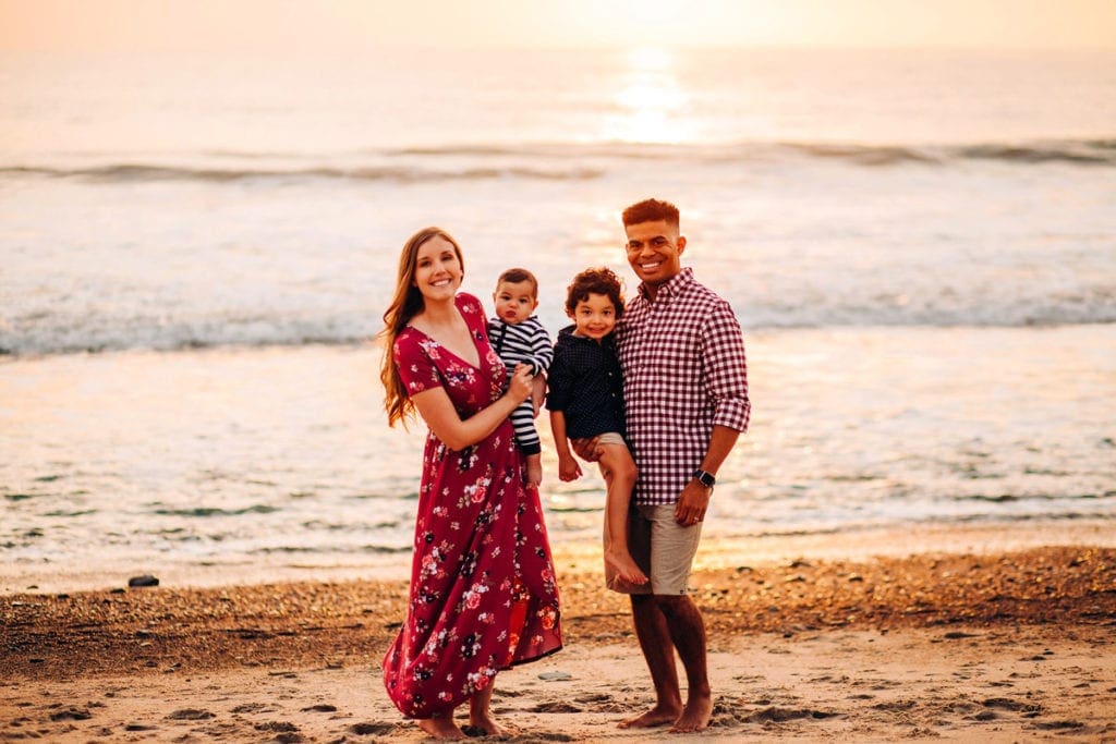 family on th beach in south California during sunset