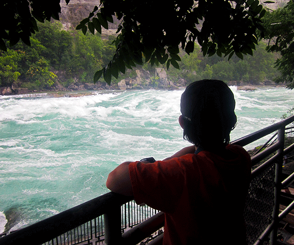 Child looking out at water in Niagara Falls