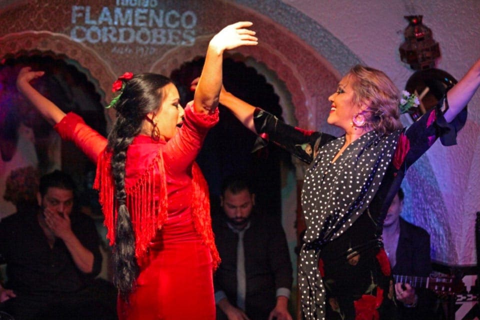 Two women dance a traditional Spanish dance at the Tablao Flamenco Cordobés.