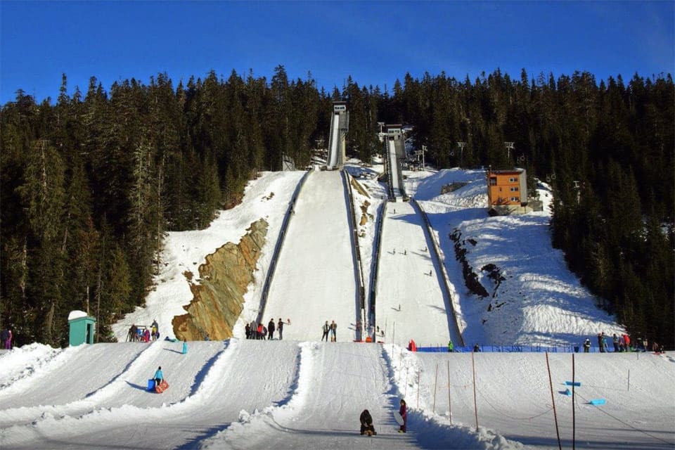 A view of the ski runs at Whistler Olympic Park on a sunny day.
