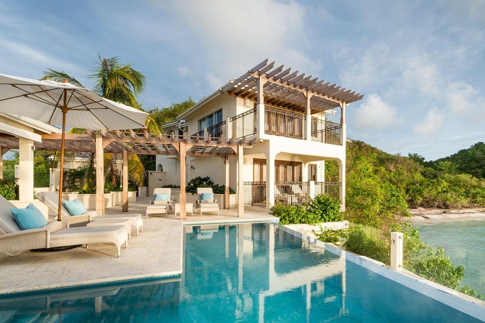 Towering above the Caribbean Sea, providing breathtaking views of the turquoise waters, Rock Cottage is a shining example of Caribbean luxury accommodations. Ideal for a family reunion, couple’s retreat or high profile guests, Rock Cottage will shower its guests with sea, sun and serenity.