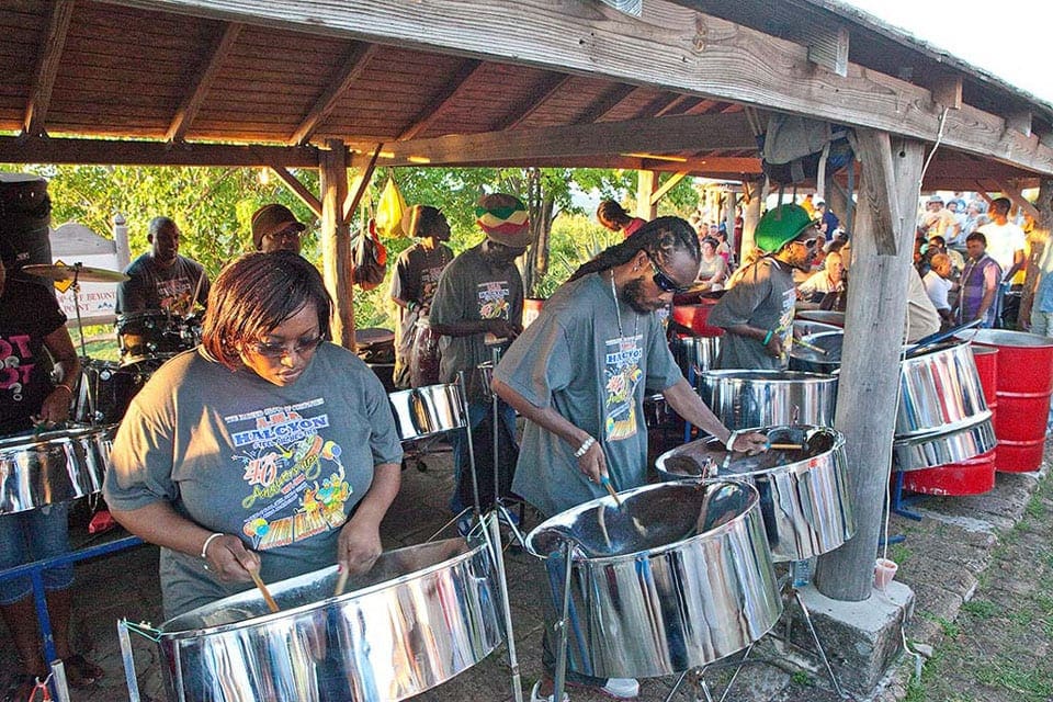 Several Caribbean drummers are playing in Shirley Heights, one of the best things to do in Antigua with kids.