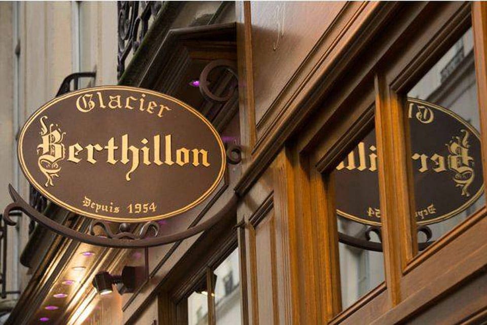 On a Parisian street, a brown sign reads "Berthillon".