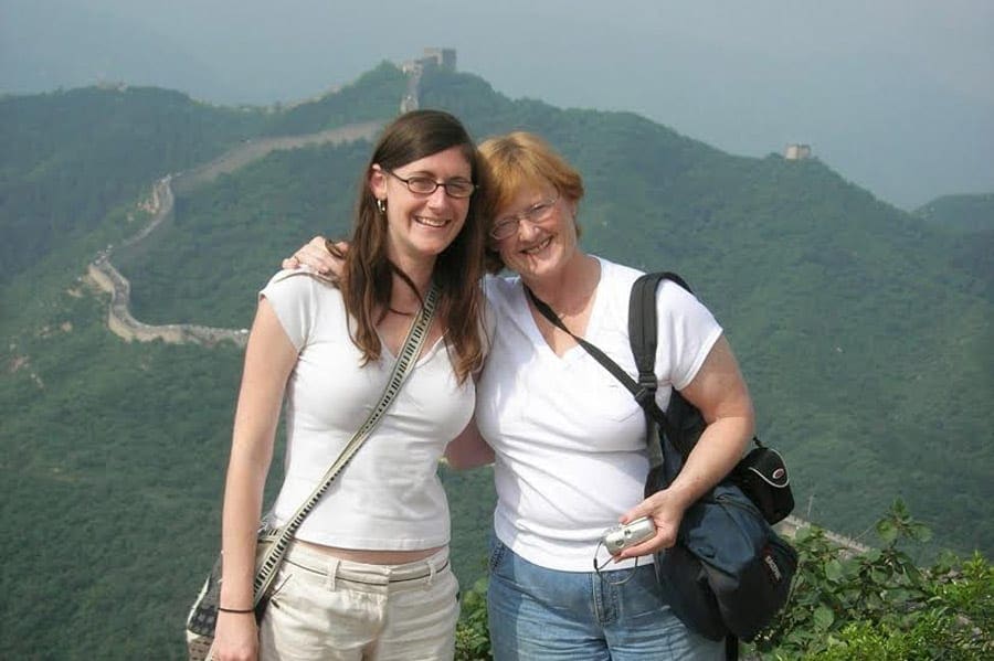 Mom and daughter in front of Great Wall of China