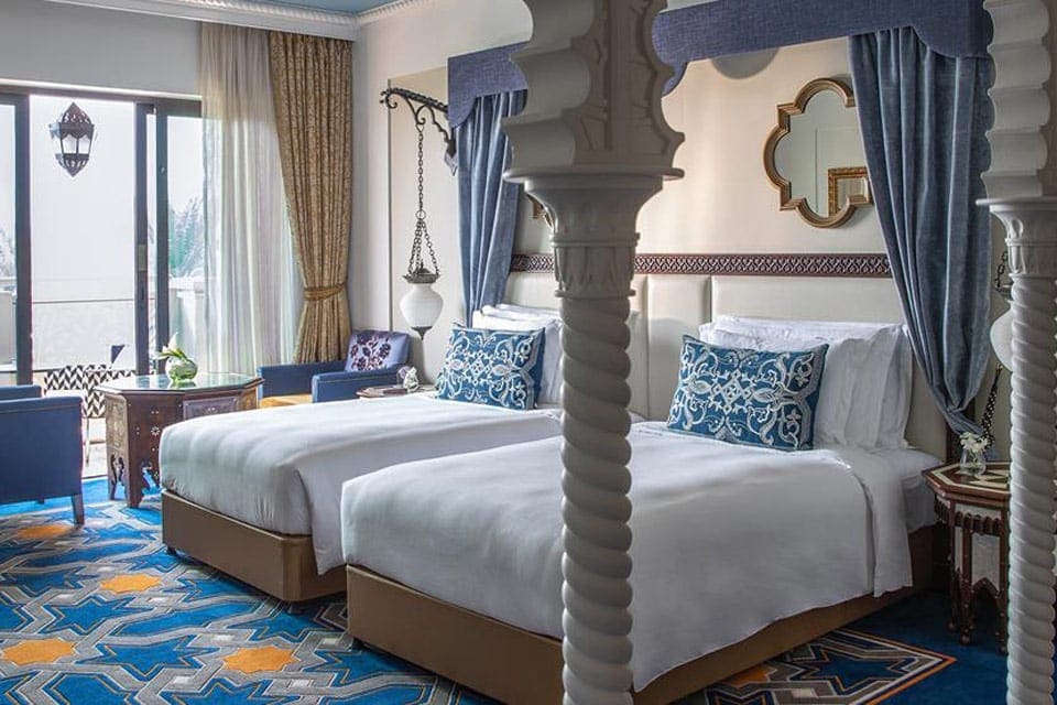 Hotel room with two beds at the Jumeirah Al Qasr hotel in Dubai.