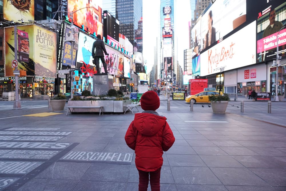 Boy in Times Square in New York City, one of the stops as we travel to New York City.