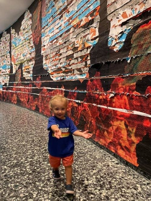 A toddler boy explores an exhibit at the Hirshhorn Museum and Sculpture Garden.