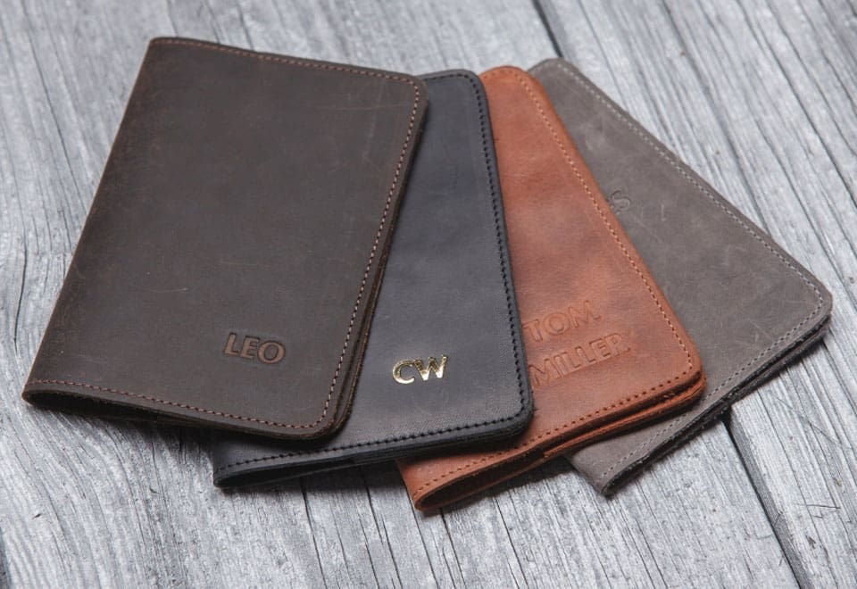 4 passport holder in various colors, one of 12 Best Travel Gifts For Dad This Father’s Day