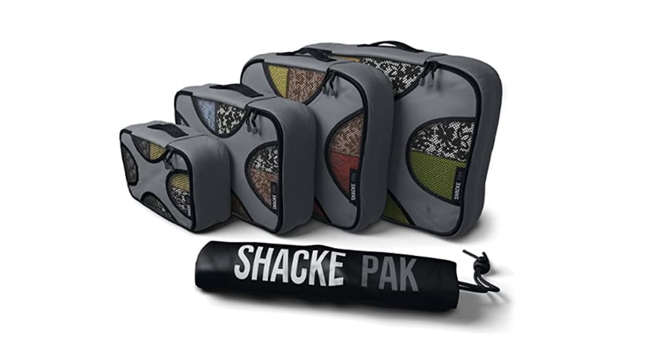 Four gray packing cubes with shake pack written on one packing cube best gifts for dads