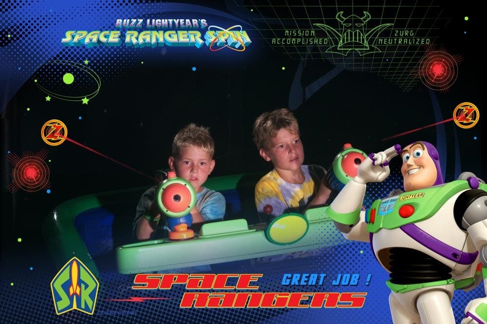 Boys on Buzz Lightyear Space Ranger Spin ride at Disney World