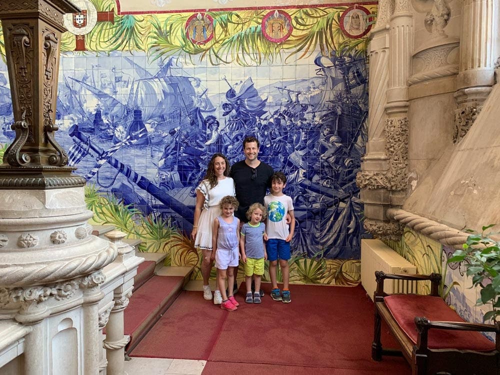 Family posing in Bussaco Palace Hotel in Portugal.