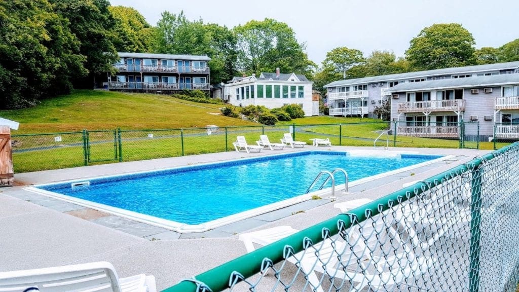 A perfectly blue pool lays still at the Smuggler's Cove Inn, one of the best Maine hotels for families.