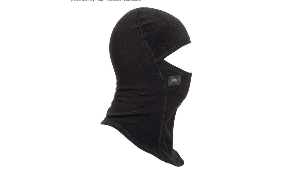 A black, Turtle Fur balaclava from the profile. A warm balaclava is a key component of our guide to ski gear for kids.