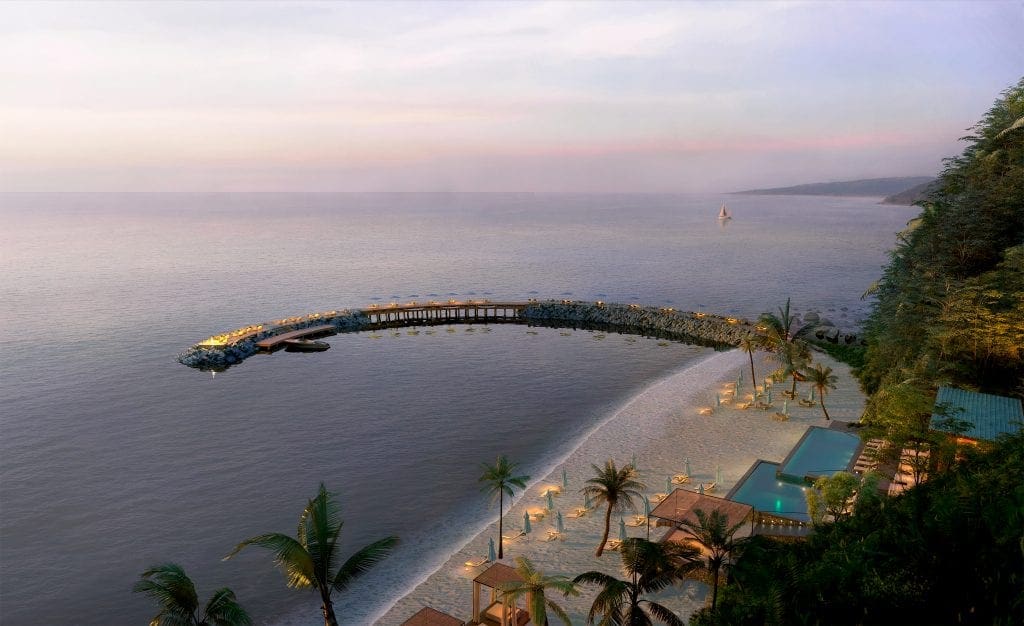 Aerial view of One&Only Mandarina, featuring a sweeping beach at sunset.