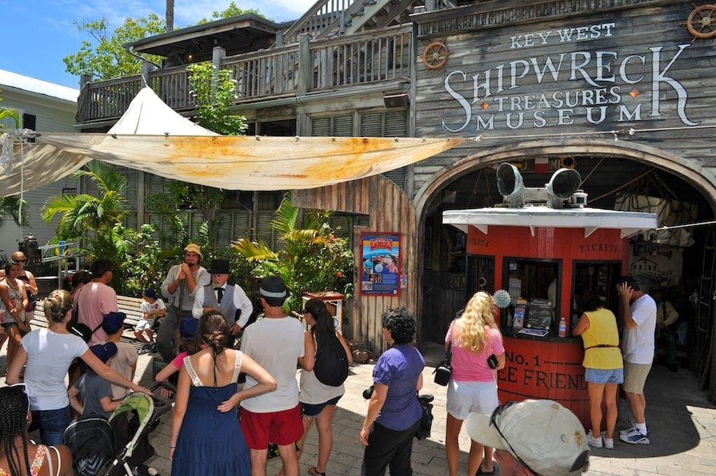 Tourists line up outside the entrance to the Key West Shipwreck Treasure Museum.
