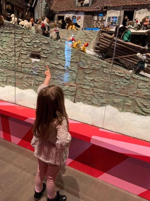 A young girl points at an exhibit in the McCord Museum, one of the best things to do in Montreal with kids.