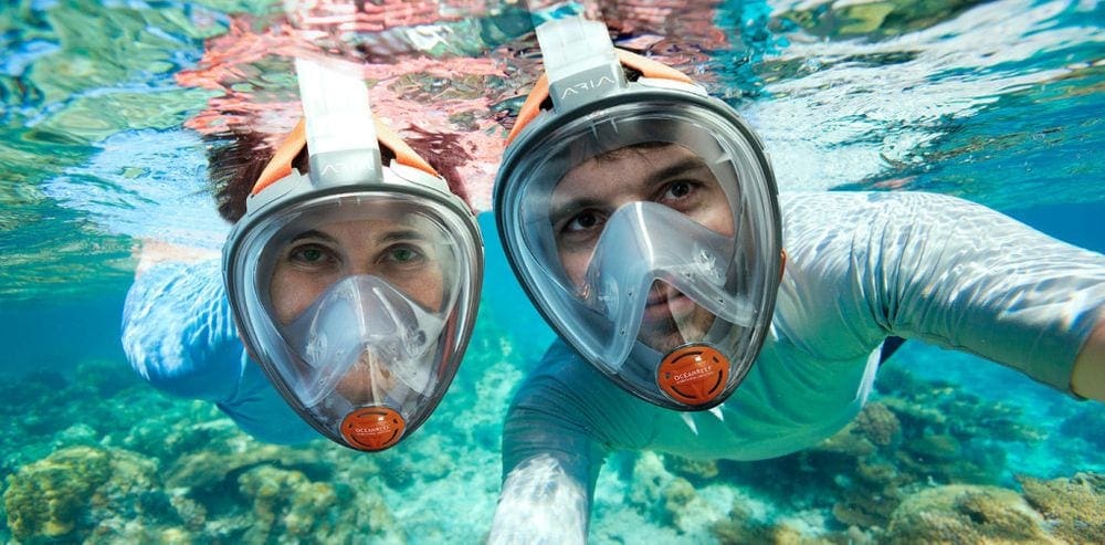 Two people snorkel in Antigua near Hodges Bay.