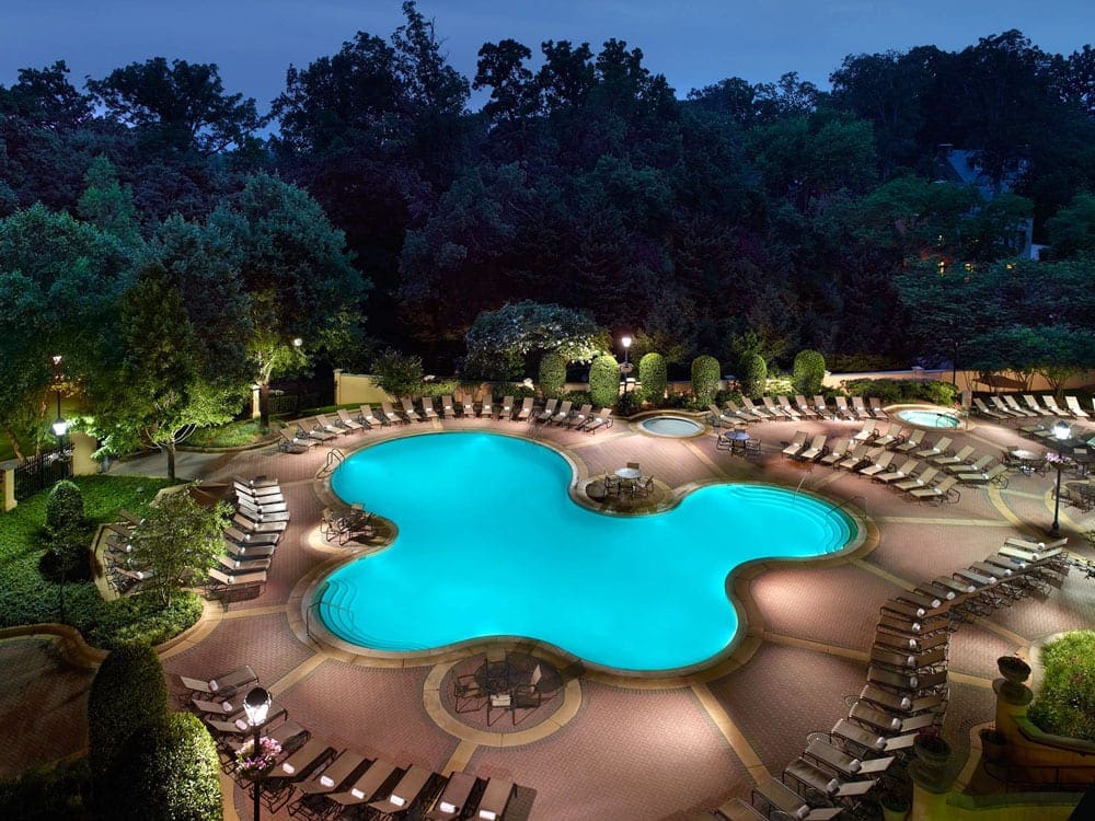 The blue pool at the Omni Shoreham Hotel at night.