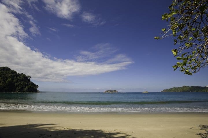 Ocean access on a clear blue day at Arenas Del Mar Beachfront & Rainforest Resort.