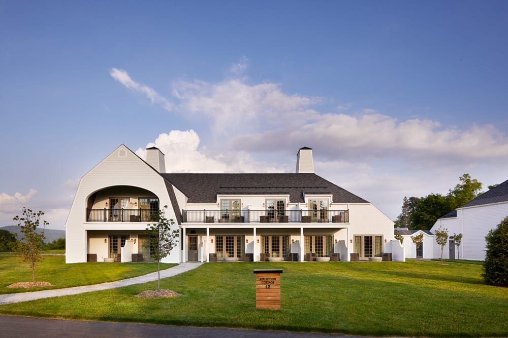 The main building at Miraval Berkshires Resort & Spa, one of the best locations for a romantic getaway in the Northeast, a posh white building with a charming ambiance.