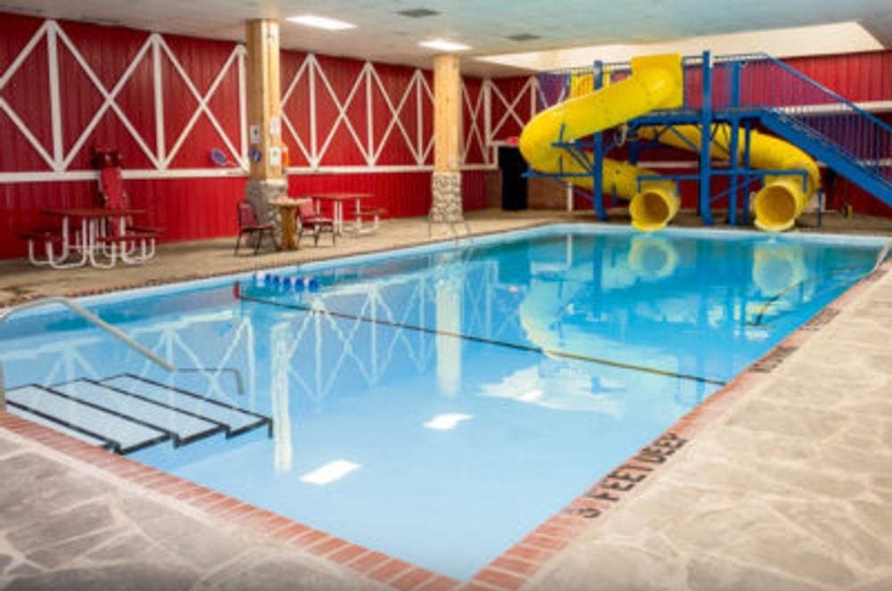 The indoor pool and double slide at the Pine Ridge Dude Ranch.