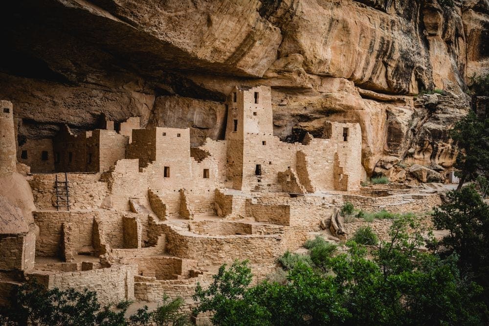 A stunning view of the remaining indigenous buildings at Mesa Verde National Park, one of the best things to do in Colorado with kids.