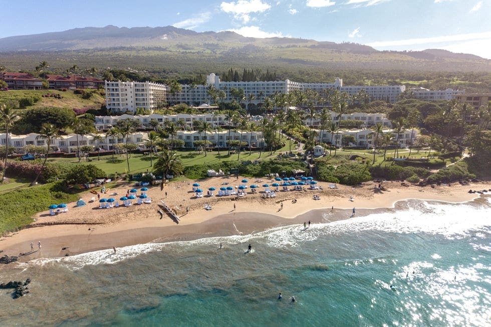 A view of Fairmont Kea Lani from the water, featuring pristine beaches and lush grounds.