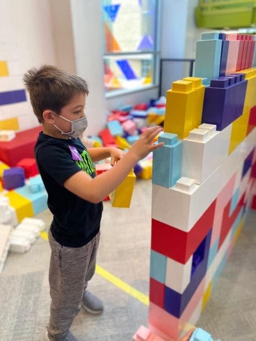 A young boy plays with blocks at the Minneapolis Children's Museum.