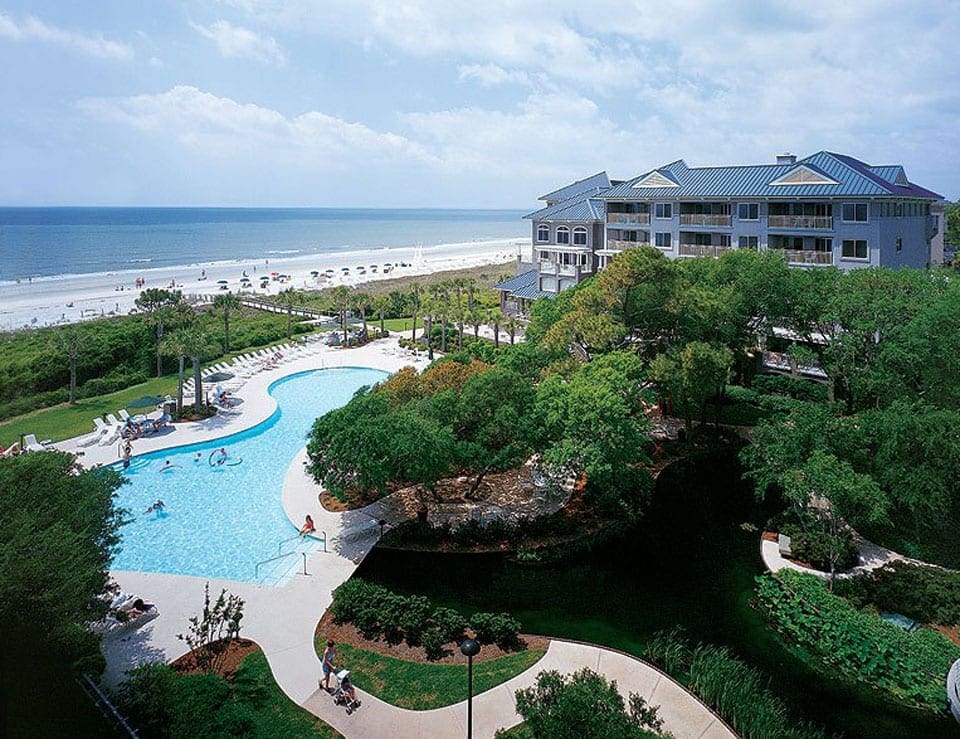 An arial view of Marriott's Grande Ocean, one of the best family hotels in Hilton Head, featuring beach access, a build, and hotel buildings.