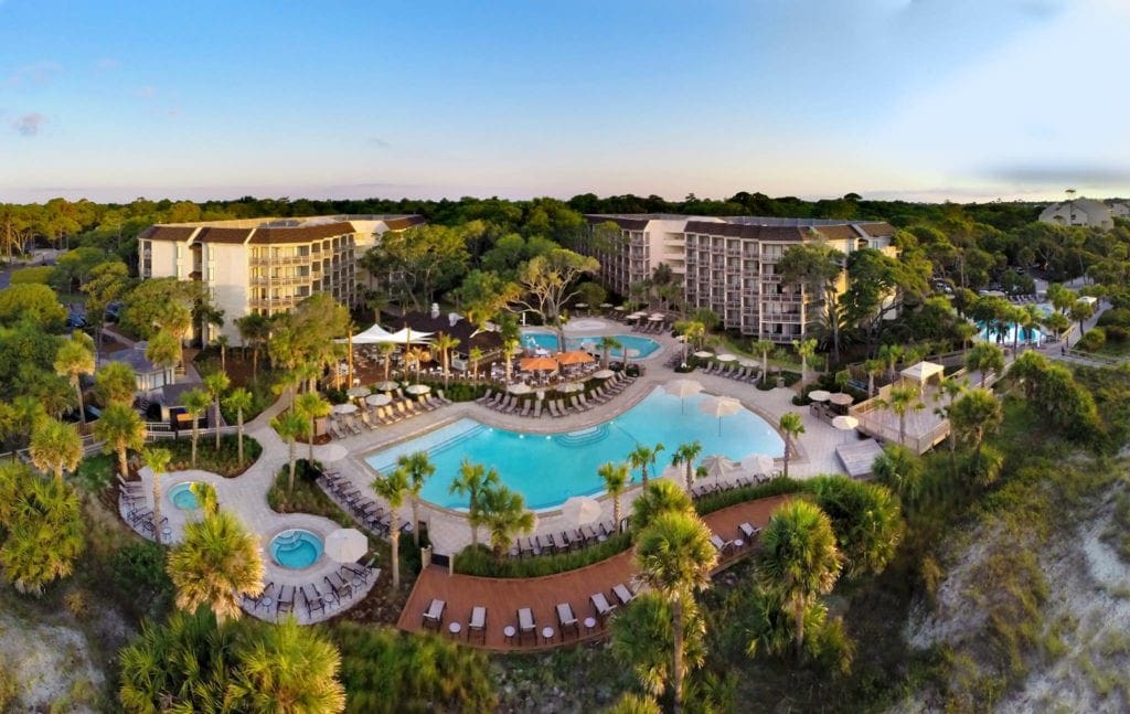 An aerial view of the Omni Hilton Head Oceanfront Resort, featuring its huge pool and resort grounds.