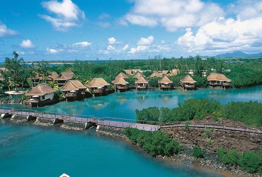 a view of the over-water bungalows at the Constance Moofushi Maldives, one of the best family hotels in the Maldives.