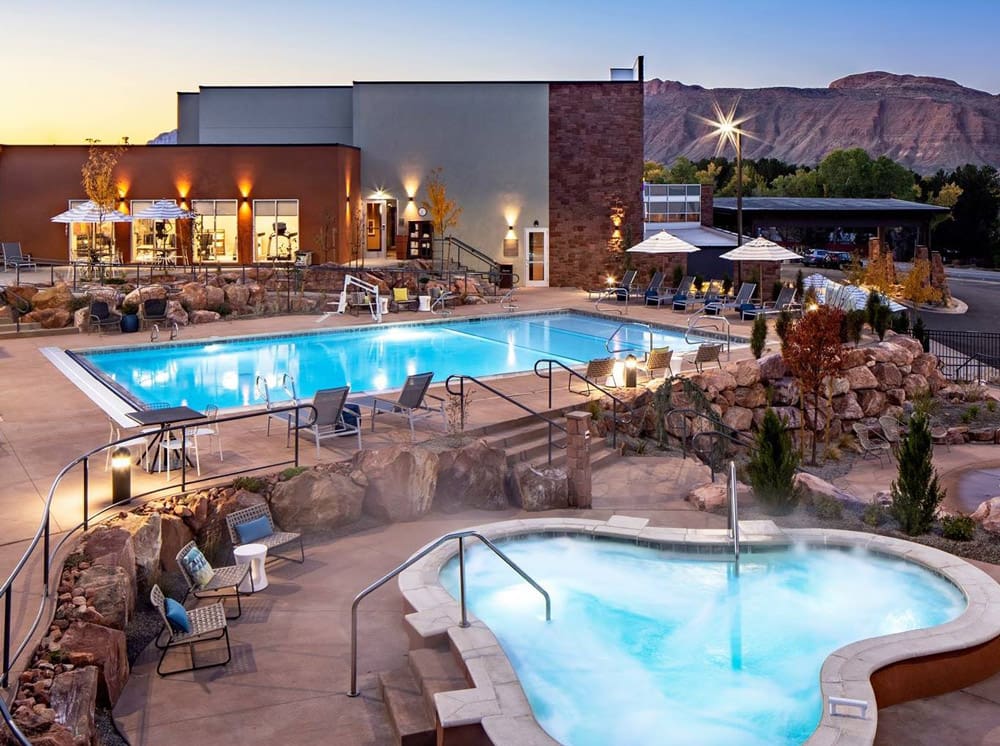 A view of the the two outdoor pools and resort grounds at Hyatt Place Moab.