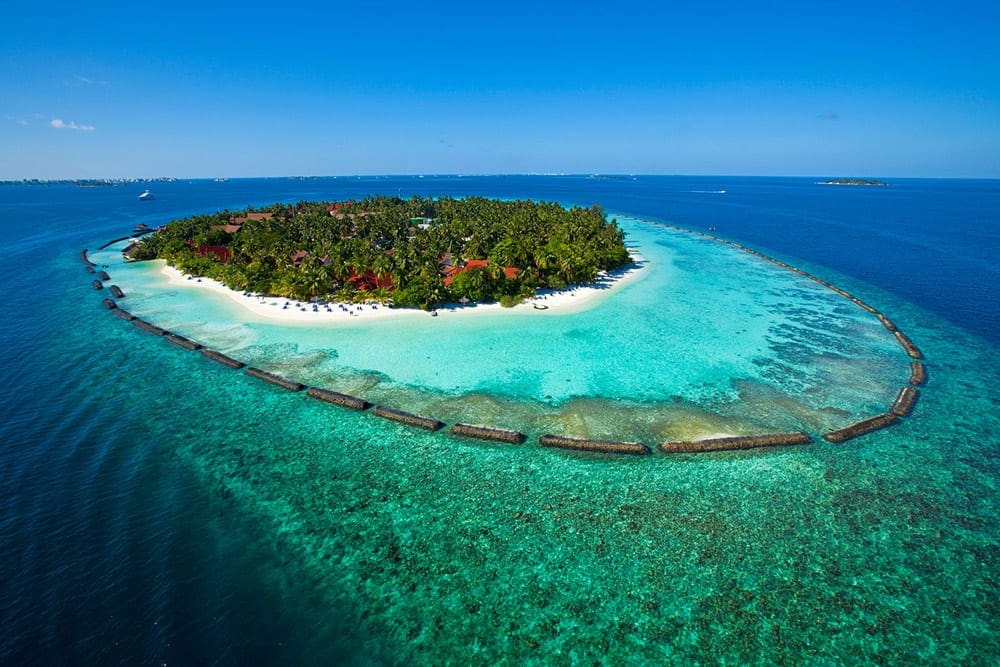 A view of the Kurumba Maldives from the air on its private island, one of the best family hotels in the Maldives.