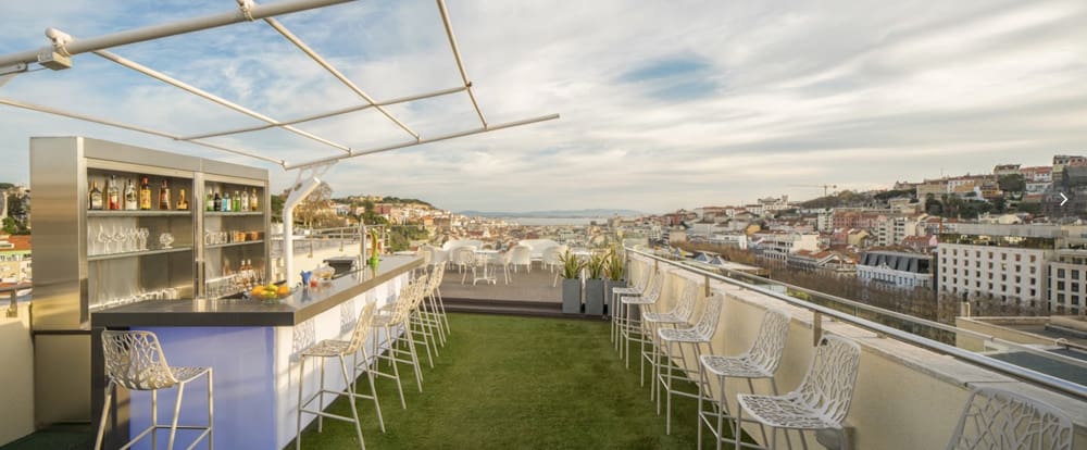 Bar seating on the rooftop of NH Collection Lisboa Liberdade, one of the best Lisbon hotels for families.