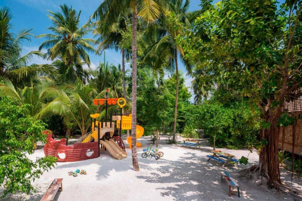 A colorful playground on the beach at the St. Regis Maldives Vommuli Resort, one of the best family hotels in the Maldives.