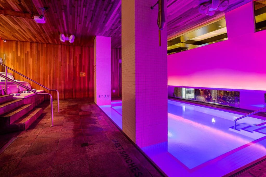 The pink and purple-hued pool at the Room Mate Grace Hotel.
