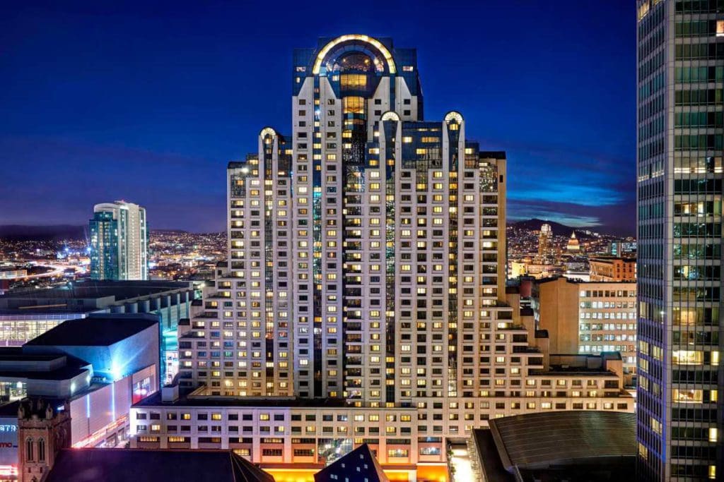 A view of the San Francisco Marriott Marquis, lit up at night.