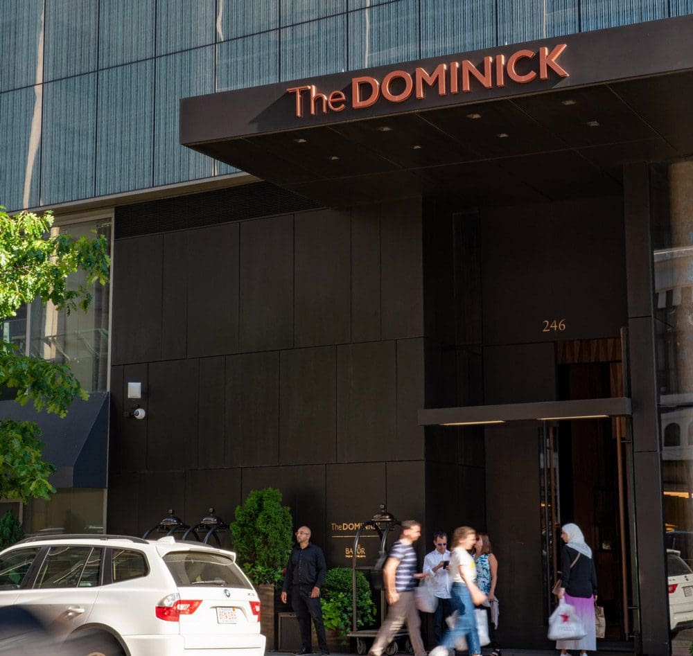 The entrance to the The Dominick Hotel, with guests coming and going.