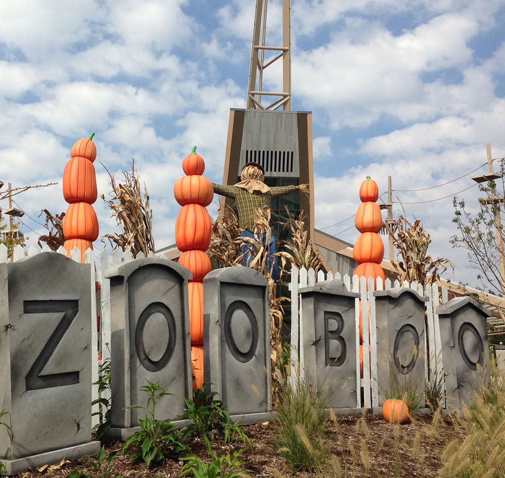 A spooky installment at the Indianapolis Zoo, featuring pumpkins and grave markers.