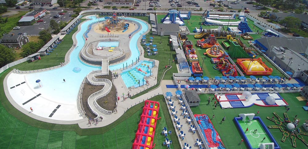 An aerial view of Cape Cod Inflatable Park, featuring a lazy river and huge inflatables.