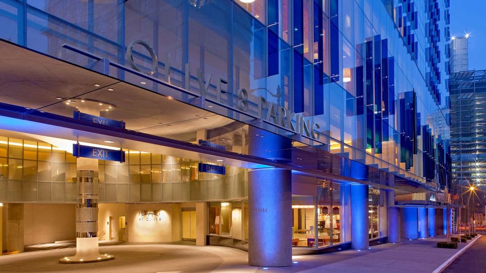 The blue and yellow hued exterior of the Hyatt at Olive 8, one of the best hotels in Seattle for families.