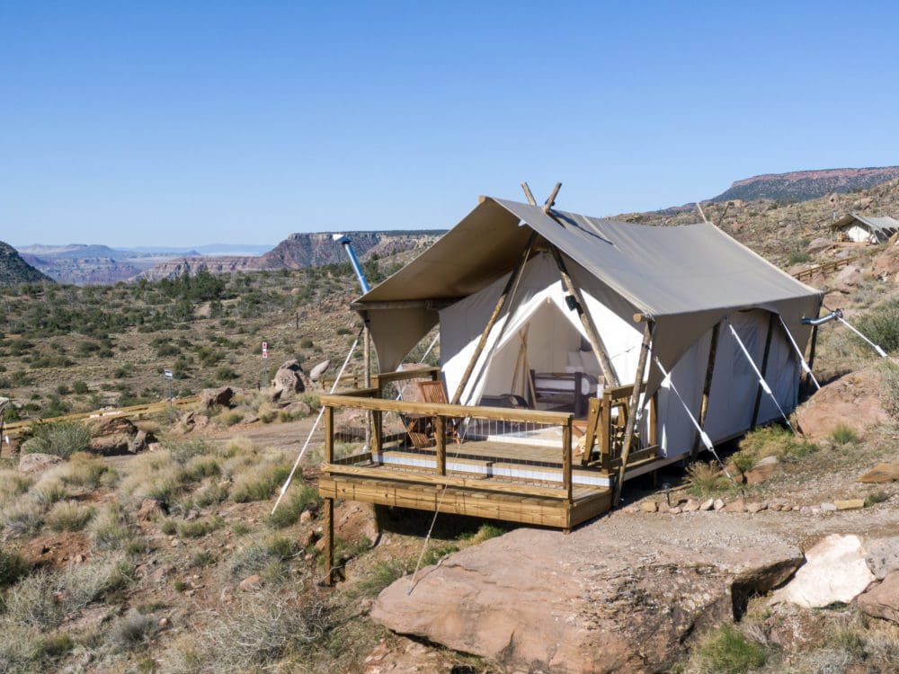 A large glamping safari tent set up in the desert at Under Canvas near Zion.