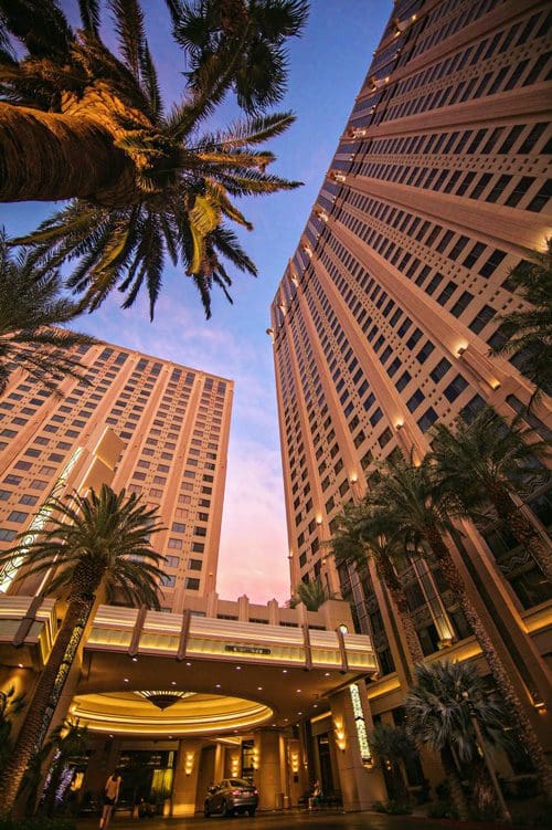 The exterior of the buildings at Hilton Grand Vacations on the Boulevard during dusk.